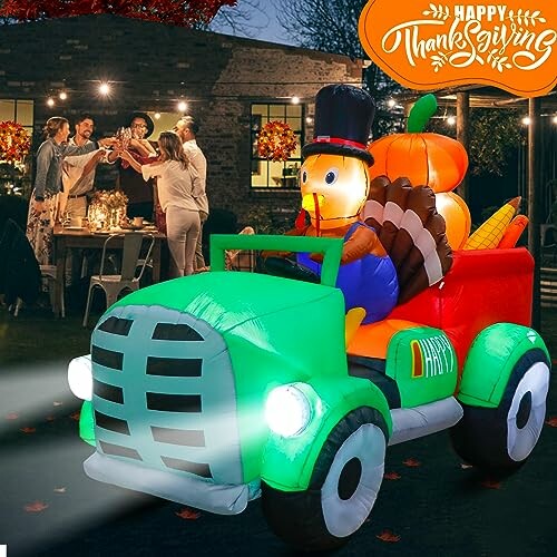 Thanksgiving celebration with inflatable turkey in a truck and people dining outdoors.